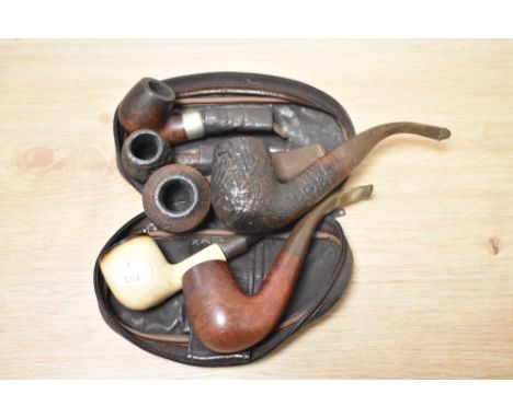 Six vintage tobacco pipes, including K &amp; B Peterson.
Also includes Trident and Dunhill.