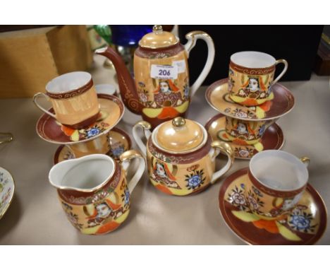 A Japanese egg shell tea set, comprising teapot, cups and saucers, milk and sugar.