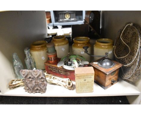 A miscellany of items, comprising; antique primitive wooden printing block, Codd bottles, enamel candlestick, tins, coffee gr