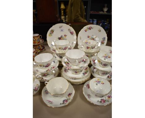 A selection of early 20th century Crescent &amp; Sons cups and saucers, plates, milk jug and sugar basin, having delicate flo