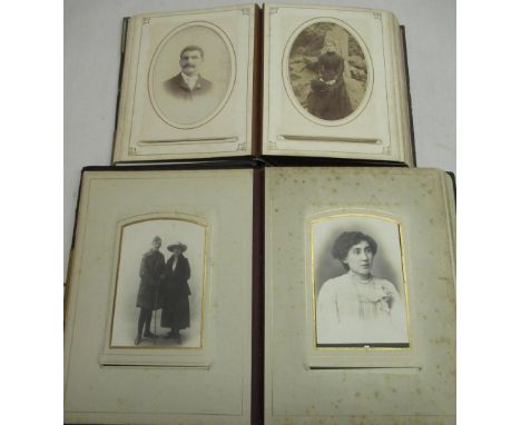 Two Victorian leather bound photograph albums containing cabinet card family portrait photographs (2) 