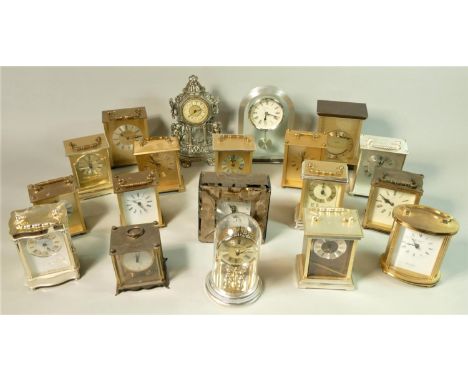 A collection of manual wind and quartz mantle clocks to include a Kundo electronic anniversary example, a London Clock Co and