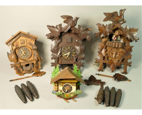 A mid 20th Century German made cuckoo clock 'Schneider' together with three other examples. (4) 
