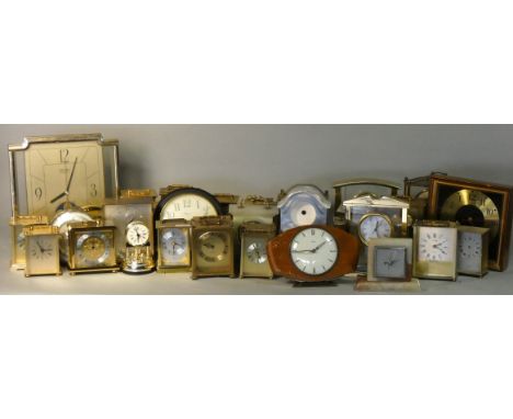 An Art Deco onyx mounted desk barometer and various brass and plastic desk clocks