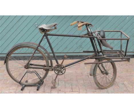 An Elswick vintage Utility Model tradesmen's bicycle, single speed with rod brakes, hinged front stand, with two Brooks leath