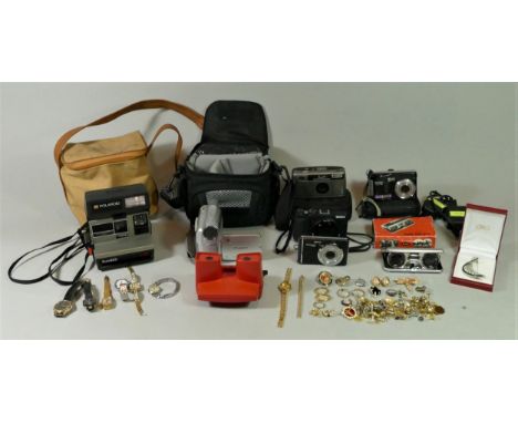 A Sony digital camera (model DSC HX60) with power cable, together with a collection of camera including a Polaroid Sun600 and