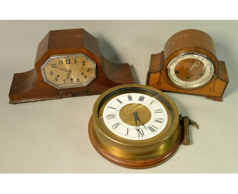 A Thomas Tompion Dutch wall clock, moonfaced with copper carved dial, together with a circular brass wall clock and two mantl