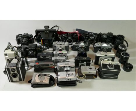 A collection of cameras and accessories, including brands such as Minolta, Polaroid and Pentax 