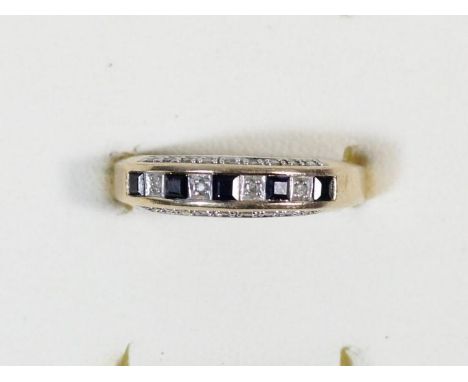 A 9ct gold sapphire and diamond ring, diamond set sides to the setting, M 1/2, 2.5gm 