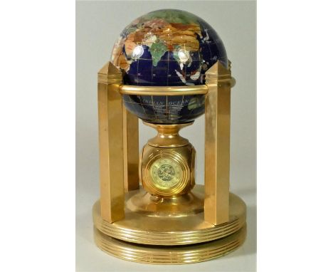 A rotating brass semi precious stone world globe, clock, thermometer and hygrometer. 20cm tall. 