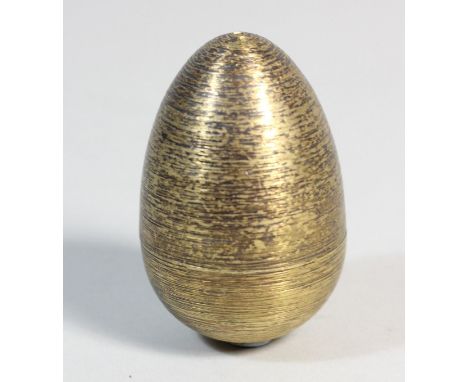 An Elizabeth II silver-gilt and enamel 'Surprise'-Egg, by Stuart Devlin, London, 1978, number 106 with textured finish, opens