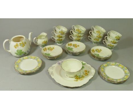 A 1930s Salisbury fine bone china tea service consisting of, six cups and saucers, milk jug, sugar bowl, cake plate and teapo