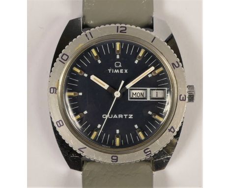 Timex Quartz, a Military style stainless steel day/date gentleman's wristwatch, model 15004, bubble back, with rotating bezel