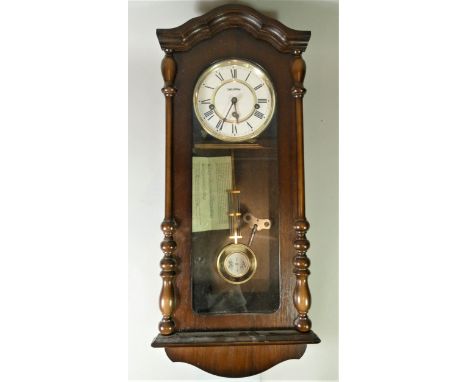 A German made manual wind Westminster chime wall clock. 