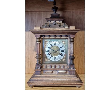 A German walnut 14 day striking mantle clock, by H.A.C., lacking two finials, pendulum, 45cm 