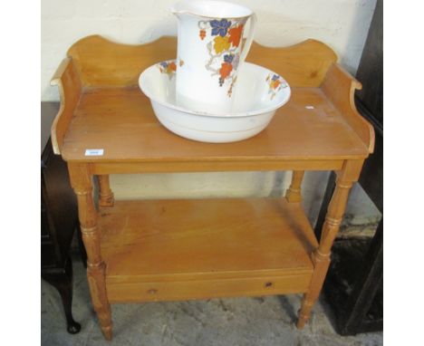 Pine two tier washstand, together with a pottery floral jug and basin set.(B.P. 24% incl. VAT)