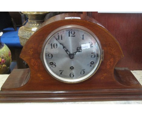 Early 20th Century inlaid mahogany three train, hat shaped mantel clock, with key and pendulum inside, within envelope.(B.P. 