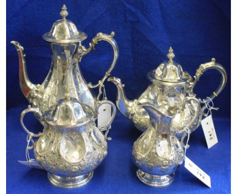 Late Victorian baluster shaped, four piece tea set with engraved repousse decoration, comprising teapot, coffee pot, sucrier 