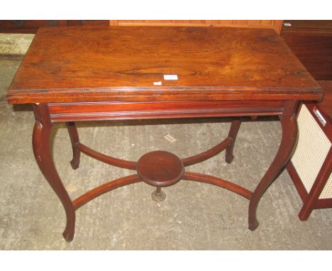 Edwardian straight fronted rosewood fold over card table, baize lined on cabriole type legs with cross-over stretchers and un