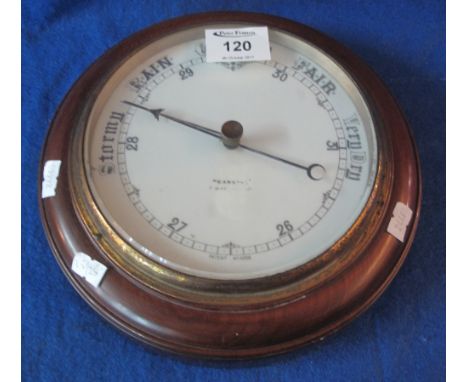Early 20th Century circular aneroid barometer with ceramic face and gilt metal bezel.(B.P. 24% incl. VAT)