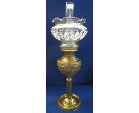 Early 20th Century brass oil lamp marked: 'The New Rochester, made in USA', having brass repousse base with iridescent shade 