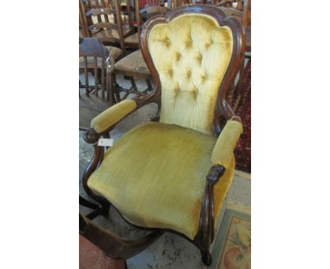 Victorian walnut show frame gentleman's fireside armchair with strapwork moulded decoration to the cresting over a button uph