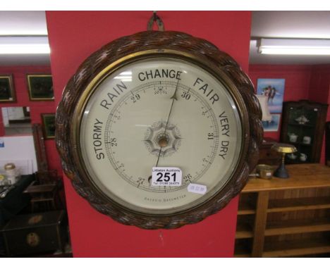 Carved oak framed barometer