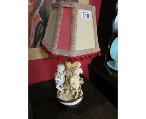 Table lamp adorned with 3 cherubs