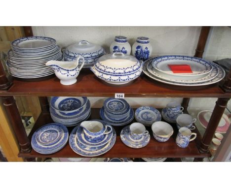 Collection of blue & white china over 2 shelves to include Losol Ware part tea service with graduated meat plates