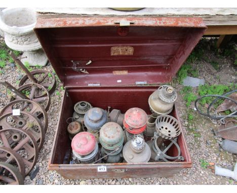 Tin trunk and contents of oil lamps