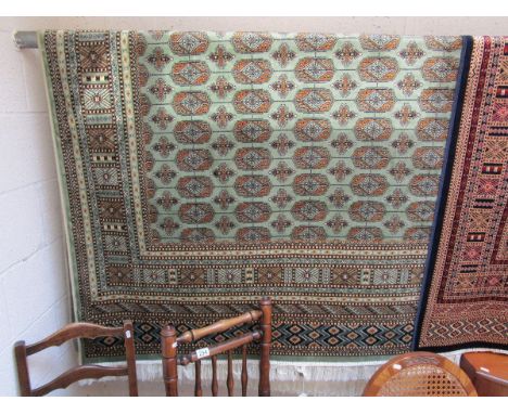 Green ground Bokhara carpet (2.3 x 1.6 metres)