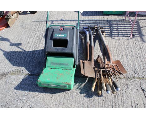 A Quolcast pedestrian mower and a range of hand tools. The electric mower complete with grass box, tools include shears and s