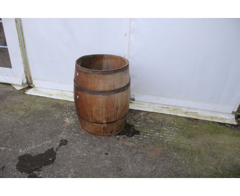 An oak flour barrel. The metal banded oak barrel the top having been removed, would make ideal planter or similar, H75cm x di