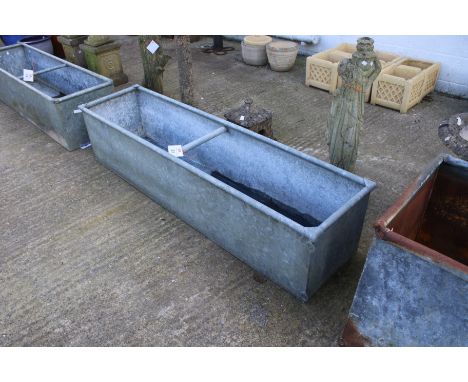A rectangular galvanised metal trough/planter. With wall mounting loops and central bracing bar, H42cm x W183cm x D47cm.
