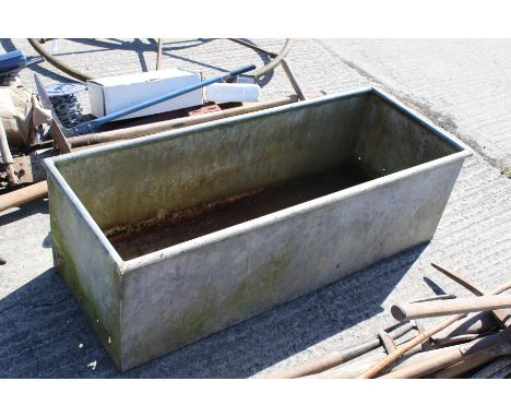 A galvanised metal trough/planter. Of rectangular form, sound in base but holes to the sides,