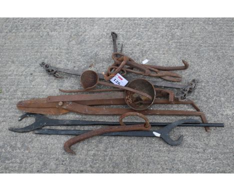 A collection of blacksmithing tools. Noting a range of shears and ladles plus a vintage set of balance scales, etc, max L120c