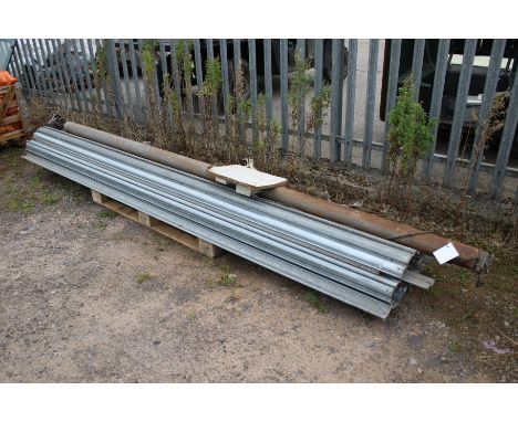 A aluminium roller shutter door. Comprising the rolling arm and the shutters, W325 approx.