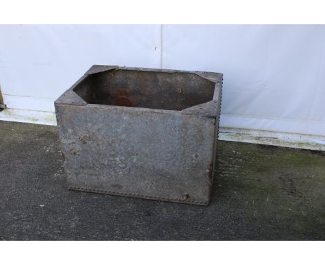 A riveted galvanised metal water tank/planter. Of rectangular form with riveted sides, without lid, not watertight, H61cm x W