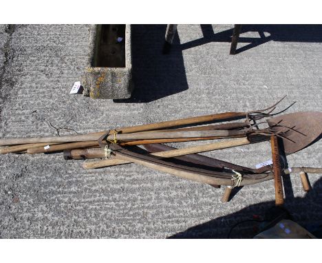 Collection of haymaking tools. Including a 19th century Fussells hay knife, five pitch forks and a scythe (needs attention) p