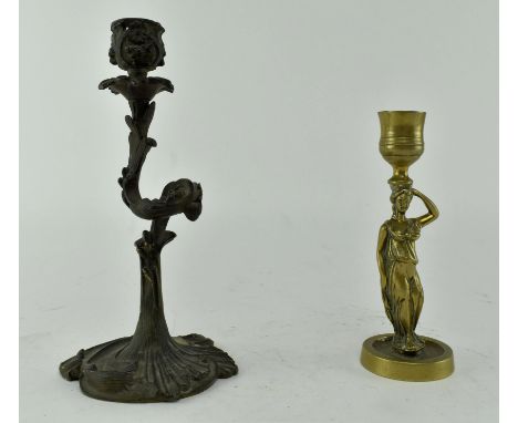 Two 19th century &amp; later continental candlestick holders. One being a 19th century French leaf pattern candlestick, the o