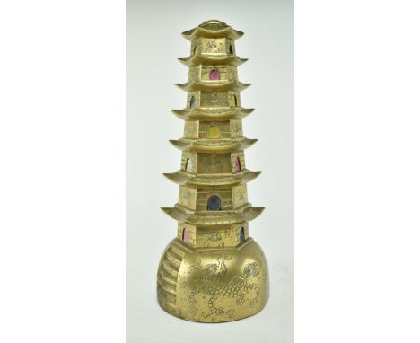 A early 20th century Chinese brass seven floor pagoda, engraved with scholars on each floor. The pagoda with Qilins (Chinese 