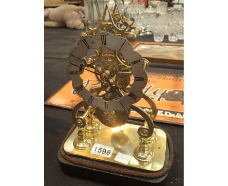 A fusee driven lacquered brass skeleton clock 