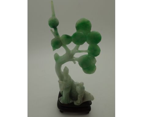 Jade Oriental figurines on a wooden base H: 16 cm CONDITION REPORT: No chips or cracks visible.