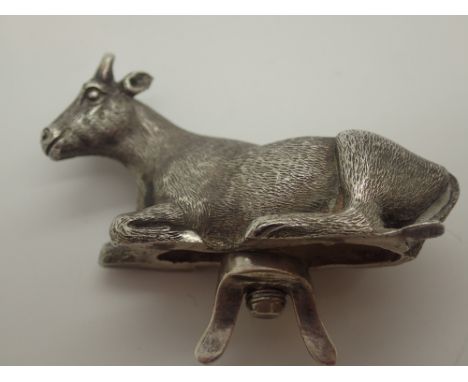 A Victorian hallmarked silver cow finial 