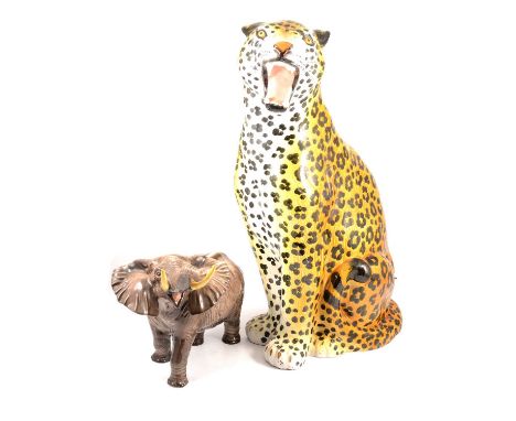 Beswick Elephant with trunk stretching, 36cm long, 26cm high (feet restored); and a large Italian terracotta leopard, circa 1