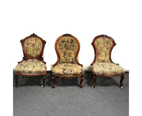 Victorian walnut nursing chair, hoop back with cabouchon cresting, machine made tapestry style upholstery, on moulded cabriol