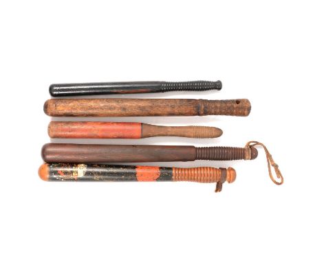 Four wooden truncheons, one painted with a crown above a cipher (possibly VR) and a red cartouche that appears painted Cambri