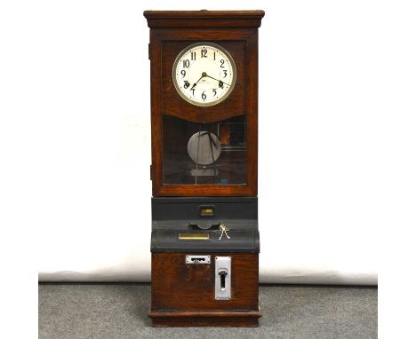 Oak cased clocking-in clock, enamel dial marked IBM International, glazed door, width 38cm, height 102cm.