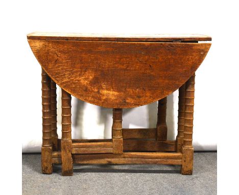 Oak gate leg table, oval top, bobbin moulded supports, 91 x 98cm, height 72cm.