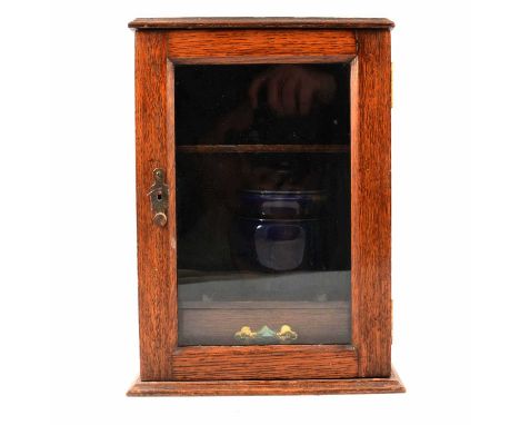 Oak smoker's cabinet, glazed door, pipe rack shelf and drawer internally, with presentation plaque to top 'Presented to L R B